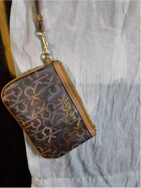 Calvin Klein wristlet featuring their signature monogram logo